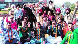 Teachers of aided colleges observe fast in protest against the government in Amritsar on Tuesday