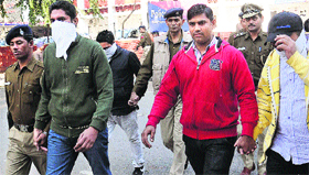 The accused, who were involved in the firing incident at the Sector 22/23 lights, being taken to the district courts at Sector 17 in Chandigarh on Tuesday.