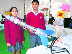 Sahil and Pareena display a model at the exhibition held at the State Institute of Education in Sector 32, Chandigarh, on Tuesday.
