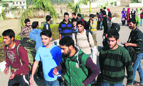Kashmiri students leave the hostel of Panchkula Engineering College, Barwala.