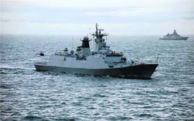 An Indian Navy Chetak helicopter approaches the deck of Chinese naval warship Ma’anshan during a recent joint exercise in the East China Sea
