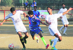 Players in action during a Christmas Soccer Championship match in Jammu on Tuesday. Tribune photo: Inderjeet Singh