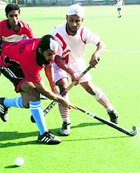 A match between Chandigarh Hockey Academy and Amritsar XI in progress on Wednesday