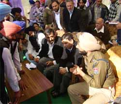 Faridkot MLA Deep Malhotra along with the DC and SSP at the Sangat Darshan. A Tribune photograph