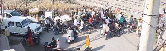 The railing at the court road railway crossing which needs to be removed for easing the traffic bottlenecks. A Tribune photograph