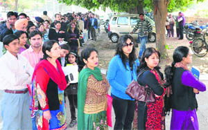 Residents queue up to buy admission forms on Wednesday. 