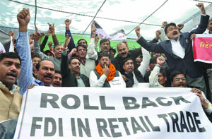 Traders shouting slogans during a demonstration against the FDI in retail at Jantar Mantar in New Delhi on Wednesday