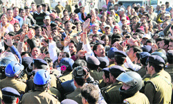 Kotdwar residents stage a protest near the Vidhan Sabha, demanding a road through Corbett National Park in Dehradun on Wednesday. Tribune photo: Vinod Pundir
