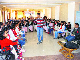 Students participate in a seminar at the Dronacharya College of Education in Rait.