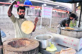 A vendor prepares food at a roadside in Jammu on Wednesday