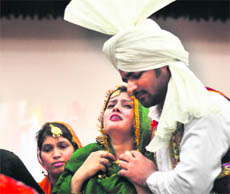 Students stage a play during a freshers party at College of Nursing, Dumra auditorium in Ludhiana. 