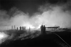 Crude oil fire: Rescue workers attempt to control a major fire that erupted along the Indian Oil Corporations crude oil pipeline from Salaya to Mathura, some 90 km from Ahmedabad, on Tuesday night