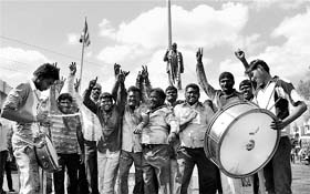 Republican Party of India workers celebrate in Karad, Maharashtra, on Wednesday