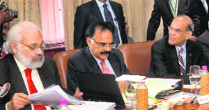 RBI governor D. Subbarao (R) at the Central Board meeting in Kolkata on Thursday. 
