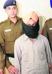 Accused Gurpreet Singh in police custody in Chandigarh on Thursday.