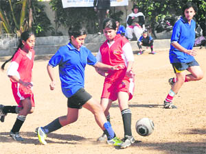 Players in action during the RF Saupin Football Trophy Tournament held at Saupins School, Sector 32, in Chandigarh on Thursday. 