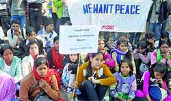 On the occasion of the 20th anniversary of the demolition of Babri Masjid, people under the banner of the Lok Raj Sangathan demand punishment to the guilty of the demolition of mosque, at Jantar Mantar in New Delhi on Thursday