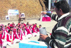 A scientist addresses students during the chemistry fair in Mussoorie on Thursday.