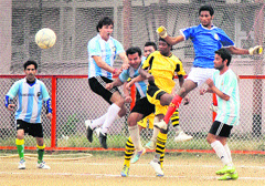 Players in action during the Christmas Soccer Tournament in Jammu on Wednesday: Tribune photo: Inderjeet Singh