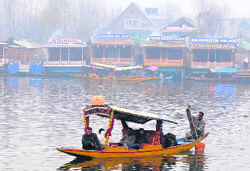 A couple enjoys a shikara ride on the Dal Lake in Srinagar on Thursday. 