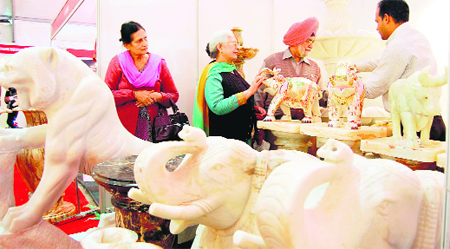Visitors at a stall at the 7th Punjab International Trade Expo that started in Amritsar on Thursday. No formal inauguration was held due to weeklong mourning in the state on the death of former Prime Minister IK Gujral. The event will witness participation from Pakistan, Mozambique, Egypt, Lebanon, Thailand, Hong Kong, Nepal, Ghana, and Afghanistan. 