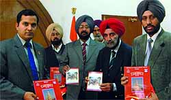Deputy Commissioner Kamal Kishore Yadav (extreme left) releases a special news bulletin and a compendium of welfare schemes during a function organised to mark the Armed Forces Flag Day in Bathinda on Friday
