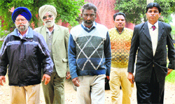 The victims kin at the Sector 5 police station in Panchkula on Friday. Tribune photo: S Chandan