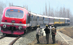 CRPF personnel stand guard near a railway track at Nowgam, 12 km from Srinagar A Tribune file photograph