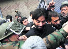 Policemen along with those who were detained  in Srinagar on Friday.