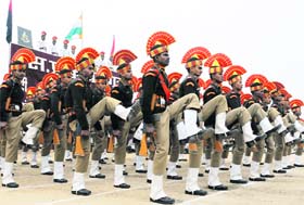 Recruits take part in a parade ceremony at the end of their training in Humhama on the outskirts of Srinagar on Friday.