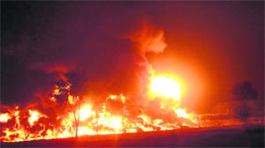 Wagons of a goods train in flames near Jarwal railway station in Bahraich on Friday. 
