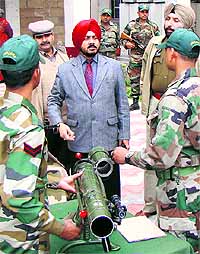 Patiala Deputy Commissioner GK Singh watches an exhibition during the Armed Forces Flag Day in Patiala, on Friday
