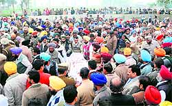 Mourners at the funeral of ASI Ravinderpal Singh at his native village Rampura in Amritsar on Friday