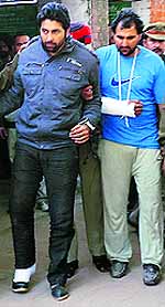 The accused, Dharam Singh and Prabhjit Singh, being taken to a court in Patti in Taran Taran