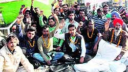 Safai karamcharis observe an indefinite fast outside GNDU in Amritsar on Friday
