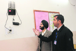  PGI officials show a cellphone jammer installed at an examination hall in Chandigarh on Saturday.