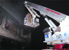 Firefighters try to douse flames at Nirman Theatre, Sector 32, Chandigarh, on Saturday night.