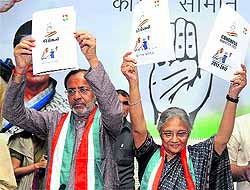 Delhi Chief Minister Sheila Dikshit and Gujarat Congress president Arjun Modhwadia releasing the party manifesto in Ahmedabad