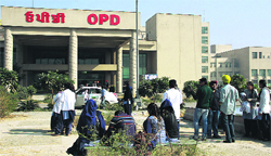 Boycotting classes, MBBS students of the Punjab Institute of Medical Sciences sit in the sun on the hospital premises in Jalandhar on Saturday. Photo: Sarabjit Singh
