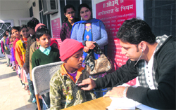 The Rotary Club holds a health check-up camp for students of an NCLP School in Jalandhar on Saturday. Tribune photo: Malkiat Singh