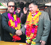JKPCC chief Saiffudin Soz welcomes newly elected Legislative Council member Ghulam Nabi Monga at a function in Srinagar on Saturday.