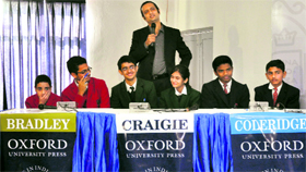 Students participate in a quiz competition in Jammu on Saturday.