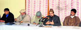 Members of moderate faction of Hurriyat Conference interact with members of minority communities in Kashmir on Saturday.