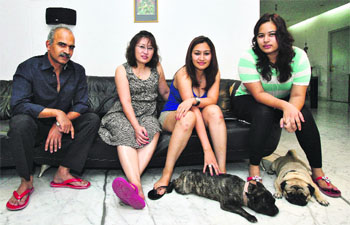 Jwala (2nd R) with sister Insi (R), mother Yelan (2nd L) and father Kranti Gutta at home in Hyderabad