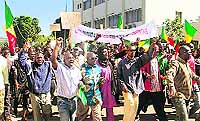 Protesters take part in a rally called by Malian political parties to support the army and demand a UNSC resolution for deployment of an international force in the country's north, controlled for eight months by Islamist armed groups, in Bamako on Saturday