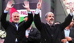 Hamas leader-in-exile Khaled Meshaal (R) and Prime Minister Ismail Haniya during the rally in Gaza City on Saturday