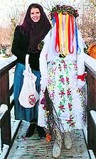 A traditionally dressed sorb girl and a sorb veiled christ child (R) at Lehde in Germany on Saturday. The veiled christ child brings luck for the coming year in caressing cheeks with its white gloves during advent season