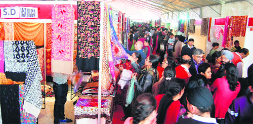 Residents throng the trade fair on Sunday. 