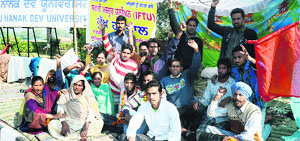Safai karamcharis on a hunger strike outside the Guru Nanak Dev University in Amritsar on Sunday.