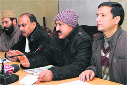 Senior leaders of the J&K Panchayat Conference address mediapersons in Srinagar on Sunday. 